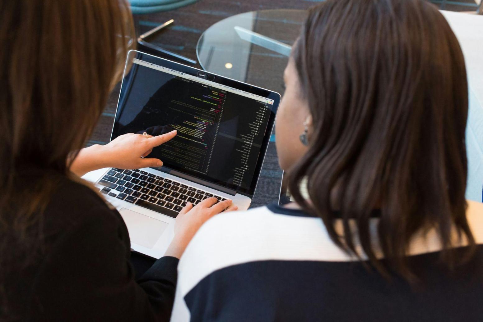 Professional reviewing detailed budget reports and financial charts